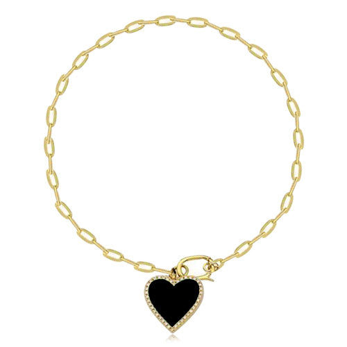 Paperclip bracelet with pavé cutout heart charm in 14k gold, luxury gold jewelry.