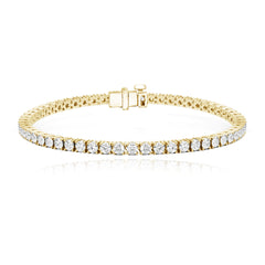 Classic diamond tennis bracelet 6cts in 14k gold, stunning luxury diamond jewelry design.