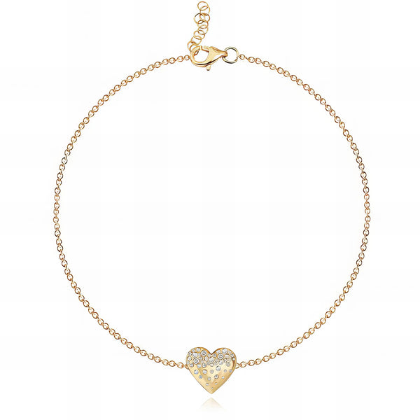 Delicate 14k gold bracelet with scattered dripping gemstones in heart design, a dainty affordable luxury jewelry piece.