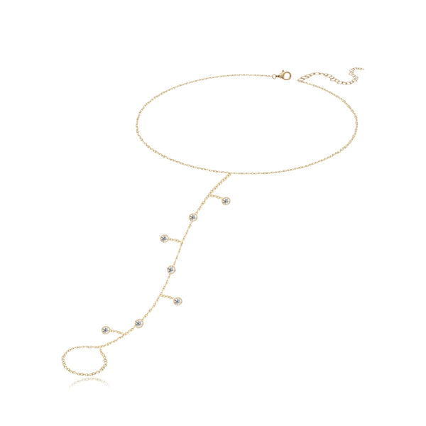 Seven dangling diamond bezel hand chain in 14k gold, a sparkly fine gold jewelry statement.