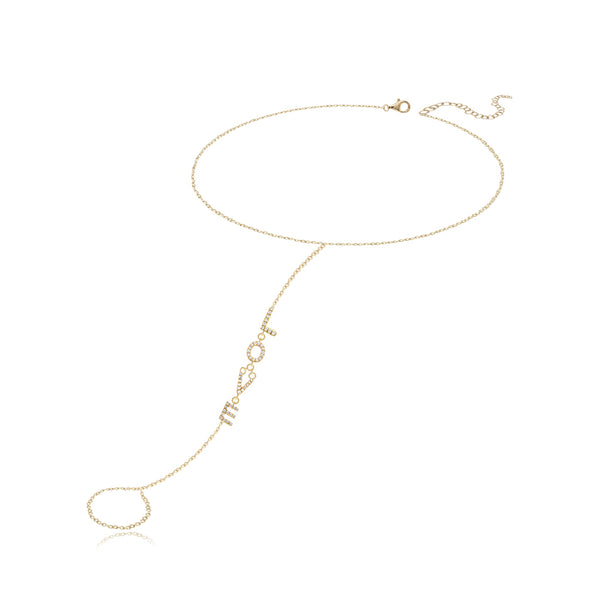 Pavé love gold hand chain in 14k gold, delicate fine jewelry with romantic luxury appeal.