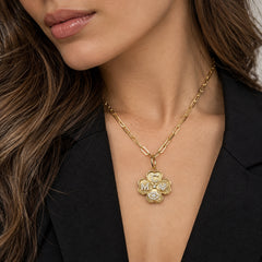 Fluted Clover Charm in 14k yellow gold worn on a gold chain necklace