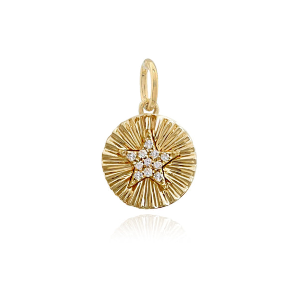 Mini pavé star charm with fluted edges in 14k gold, dainty piece of luxury jewelry.