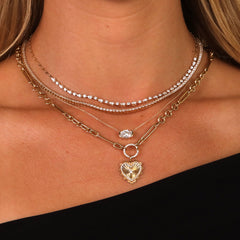 Mixed Paperclip Link Chain with heart charm layered with gold and diamond necklaces on model