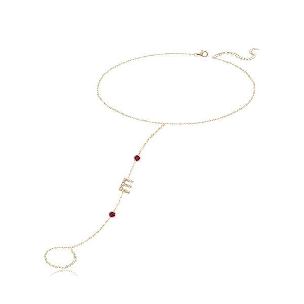 Pavé initial and gemstones hand chain in 14k gold, a luxurious personalized jewelry piece.