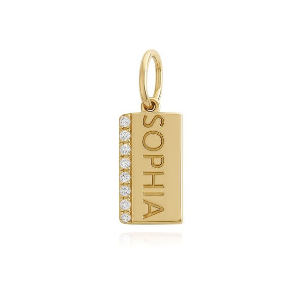 Mini personalized pavé charm in 14k gold with side engraving, a unique piece of personalized jewelry for women.