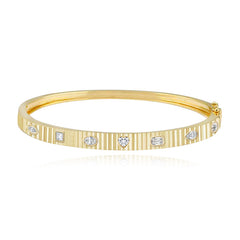 Multi shape diamonds fluted bangle in 14k gold, sophisticated and elegant fine gold jewelry.