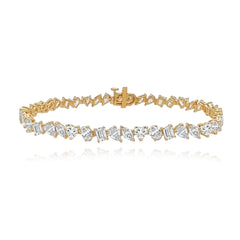Multi shape diamond tennis bracelet in 14k gold, a luxury fine jewelry statement piece.