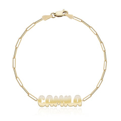 Cutout name paperclip bracelet in 14k gold, perfect personalized jewelry gift.