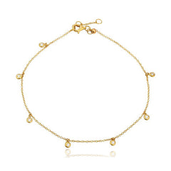 Dangling bezels anklet in 14k gold, shimmering fine gold jewelry for luxe day-to-night looks.