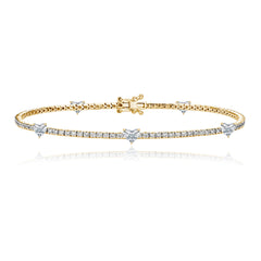 Five diamond heart tennis bracelet in 14k gold, romantic fine jewelry for luxury lovers.