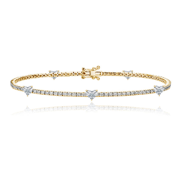 Five diamond heart tennis bracelet in 14k gold, romantic fine jewelry for luxury lovers.