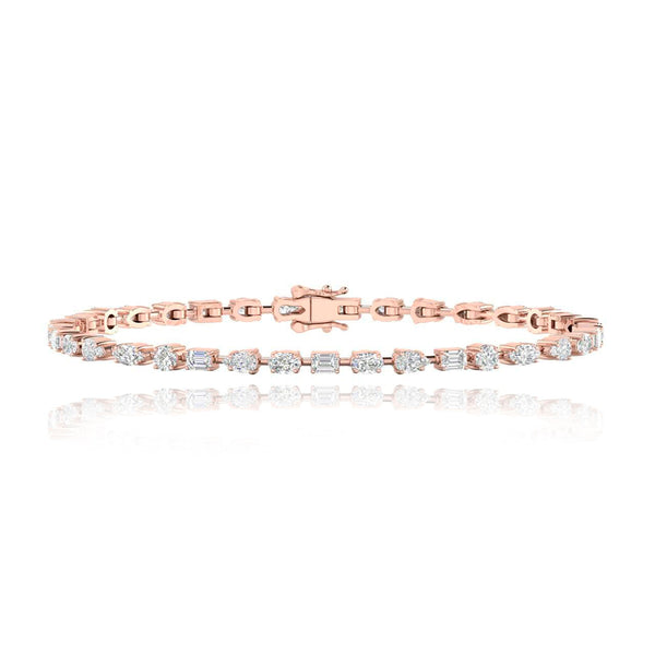 Horizontal multi shaped diamond tennis bracelet in 14k gold, timeless luxury diamond jewelry piece.