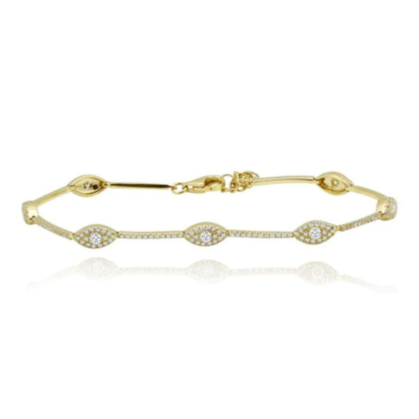 Multi evil eye tennis bracelet in 14k gold, protective fine jewelry with a luxe custom twist.