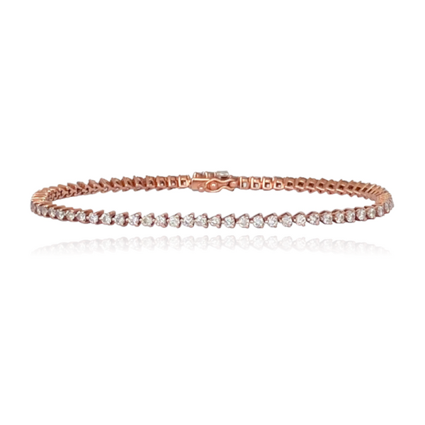 Three prong tennis bracelet in 14k gold, dainty fine jewelry piece with luxury diamonds.